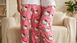 A couple wearing matching pink hello kitty pants